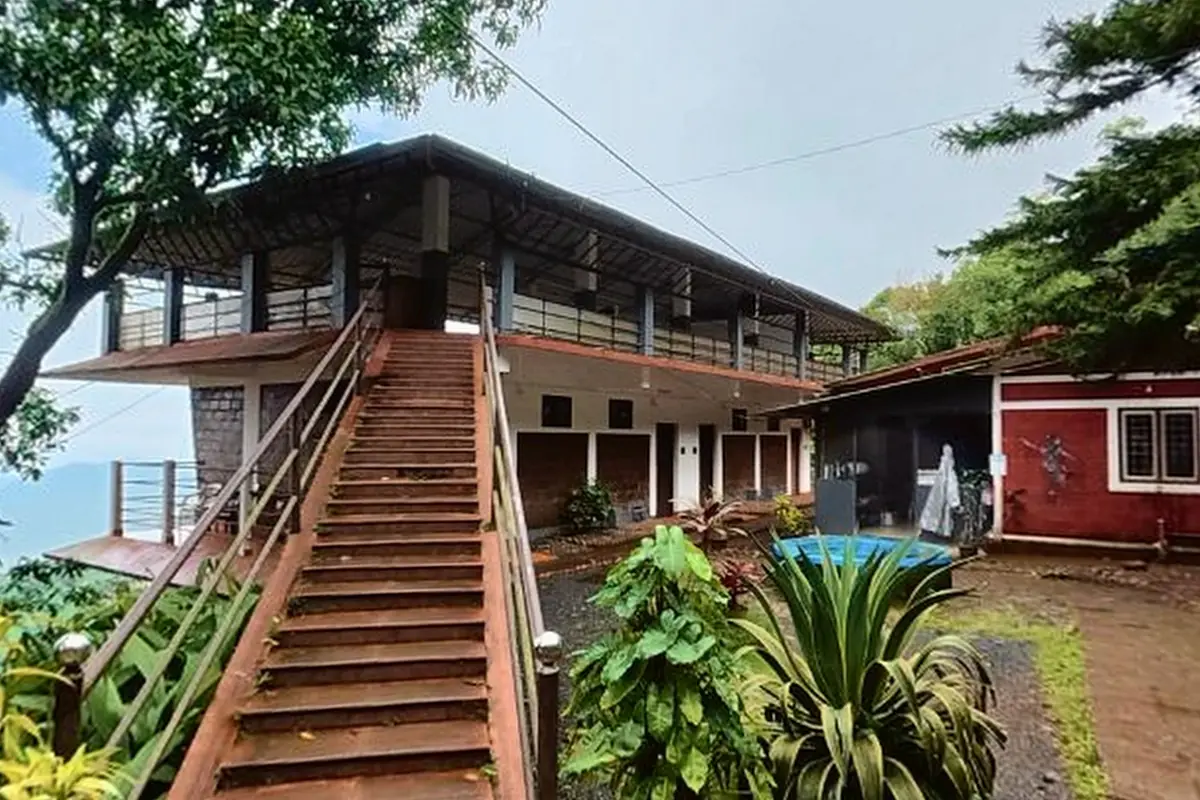 Stone stairs through the garden to the upper block