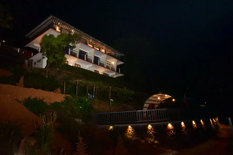 The resort block lit at night