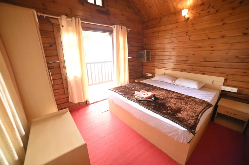 Wooden villa bedroom with timber walls